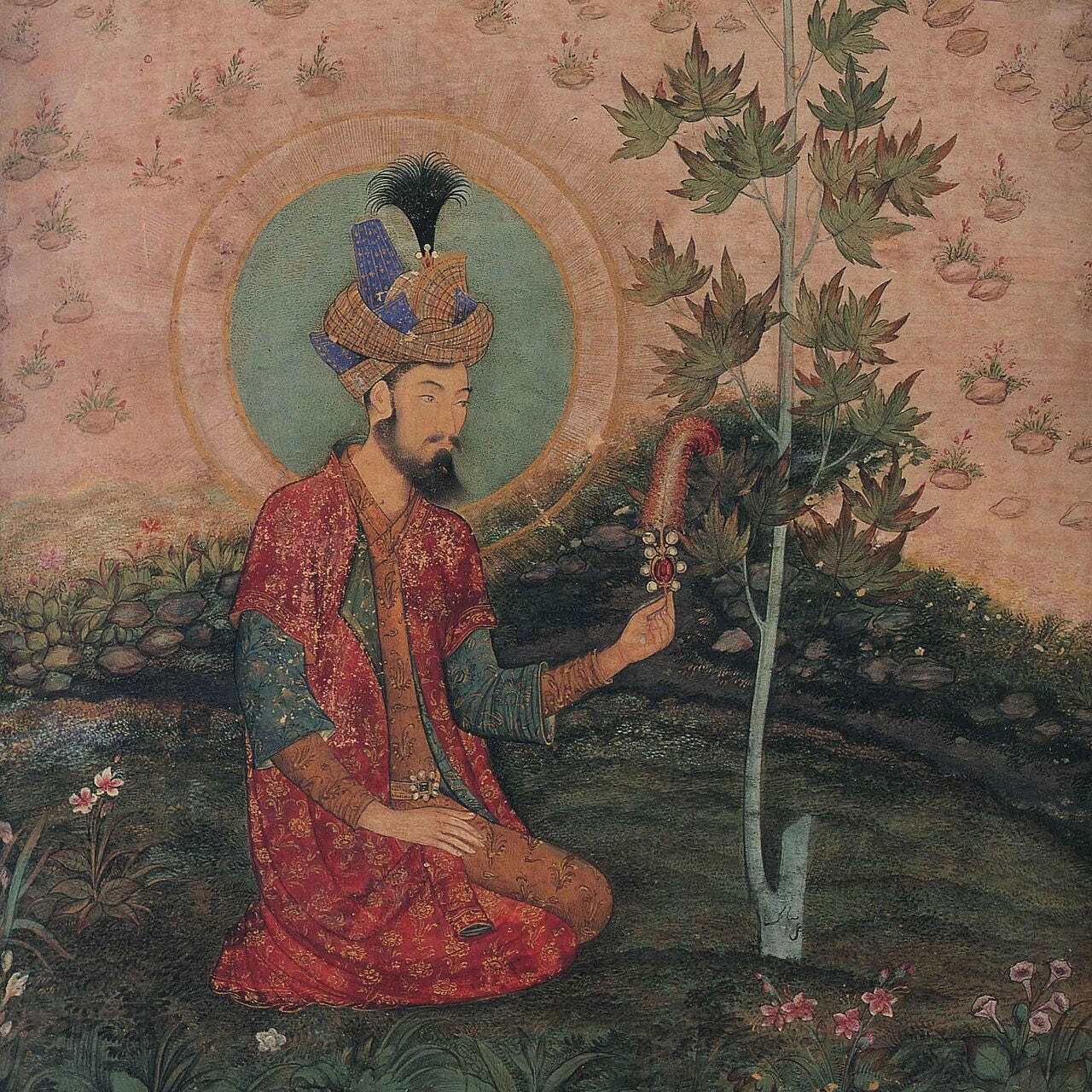 A Mughal painting of the emperor Humayun seated in a landscape.
