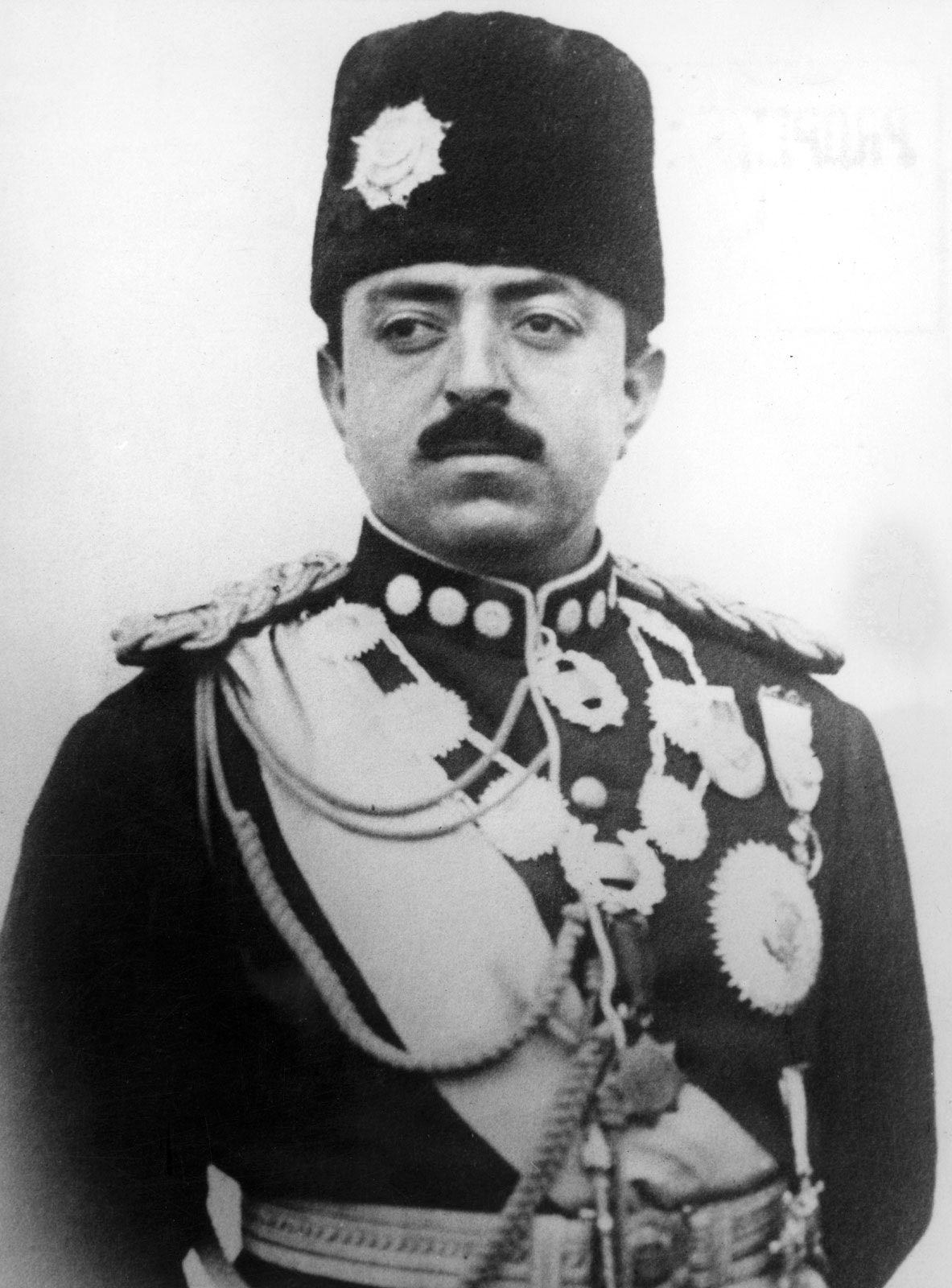 A formal portrait photograph of King Amanullah Khan in uniform.