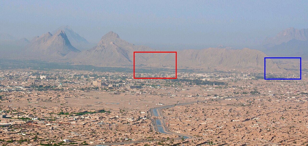 An aerial view of the ruins of Old Kandahar beneath the rocky Chil Zena ridge.