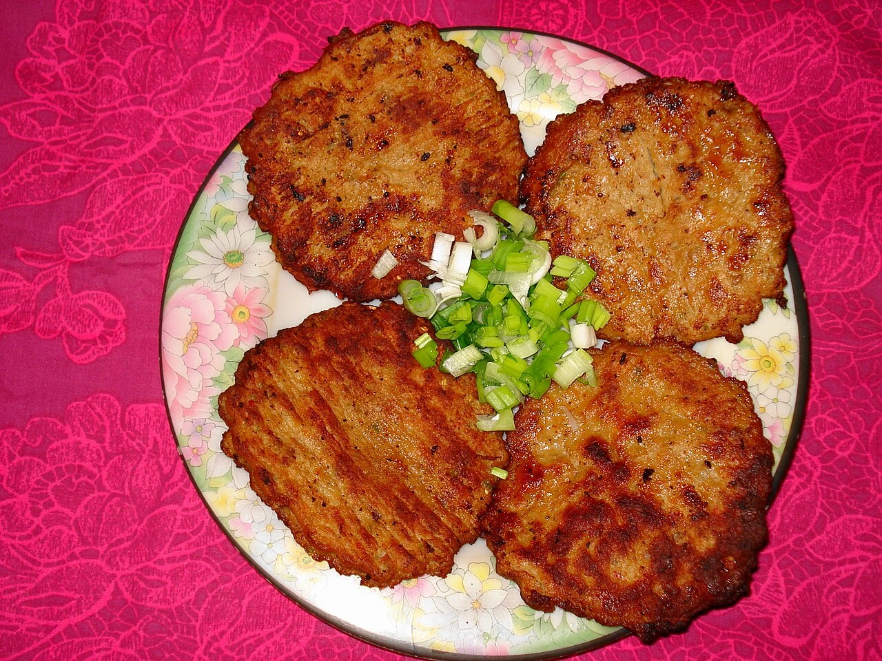 Chapli kebabs on a plate.