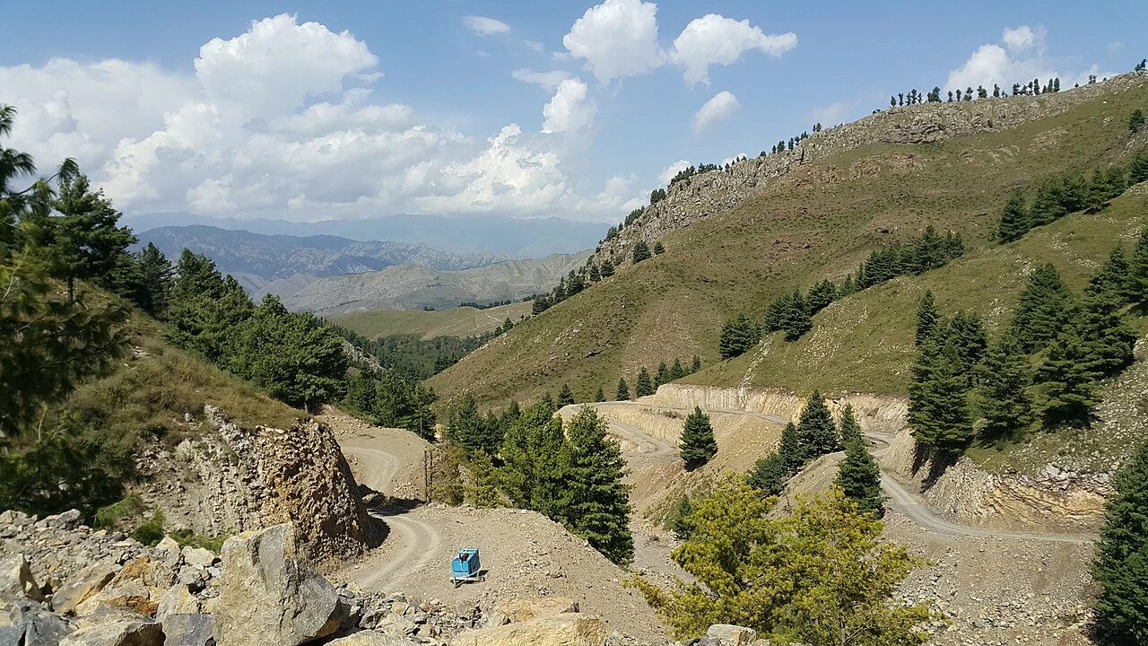 A green valley among mountains at the start of the Tirah valley.