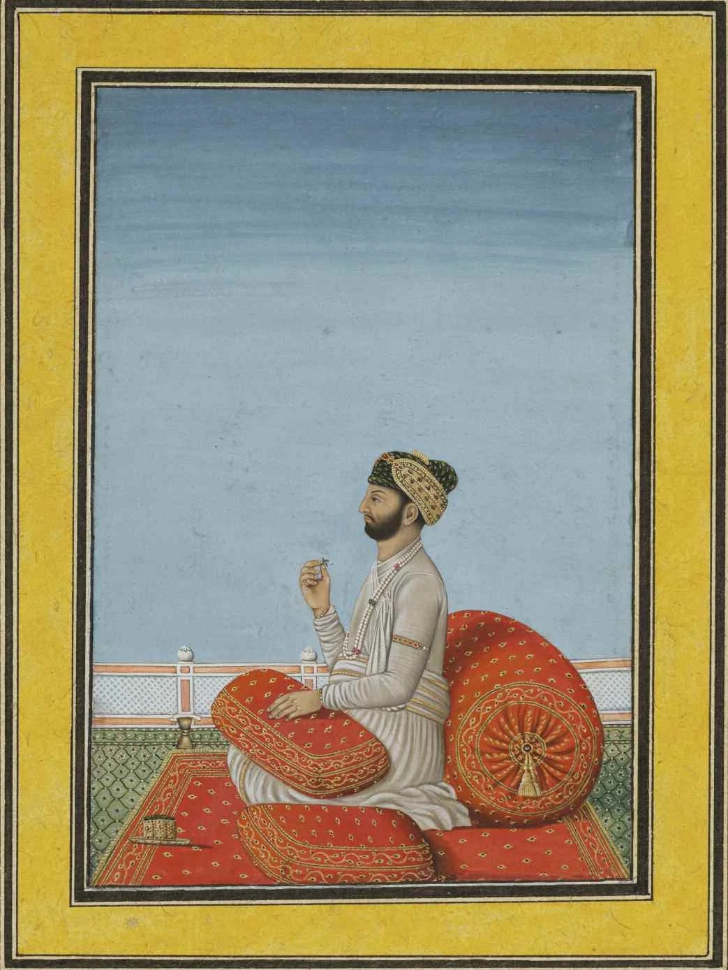 Indian court painting of a seated man in a turban and white robe