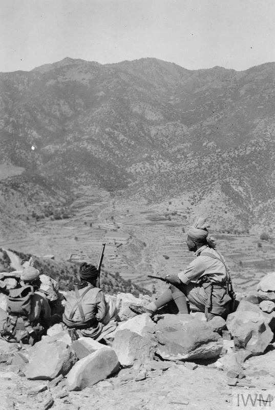 Soldiers keeping watch from a rocky hilltop